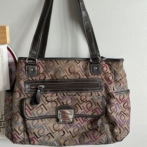 Gently used and lot of space for all of your things plus two side pockets.